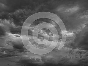 Black white sky with clouds. Dramatic cloudy sky background for design. Dark gray cloudscape.