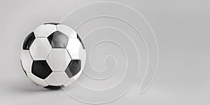 black and white soccer ball or football on gray background with copy space