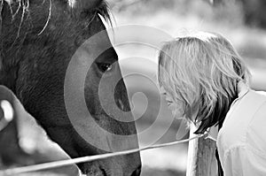 Black white soft loving tenderness woman and horse