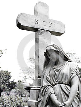 Black and White Sorrowful Woman with Veil under the Cross