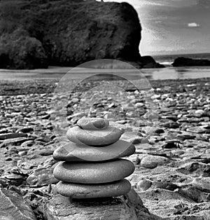 Black and white stacking stones on the beach
