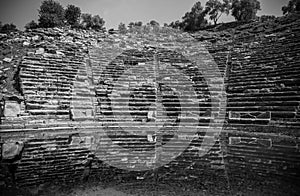 Black and white Stratonikeia Ancient City theater with reflection. A view from the stage area. City of Gladiators. Mugla, Turkey