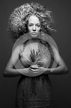 Black and white studio portrait of a young cute girl