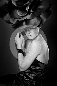 Black and white studio portrait of a young cute girl