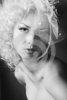 Black and white studio portrait of a young cute girl