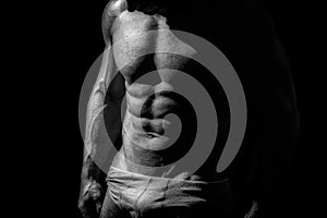 Black and white studio shoot of strong athletic man