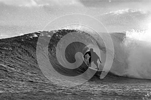 Black and White Surfer Surfing the Tube photo