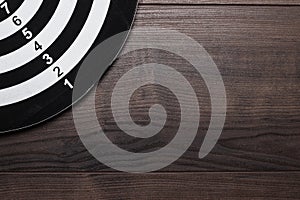 Black and white target on wooden background