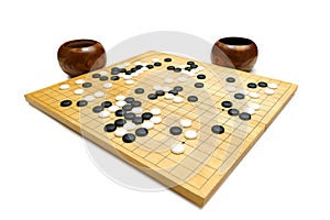 Black and white tones on a wood board - called Baduk, Weiqi, iGO