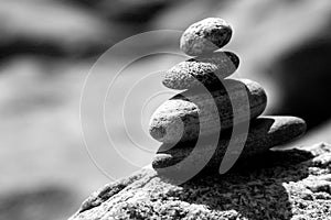 Black and White tower of river rocks, four, zen, with soft focus background