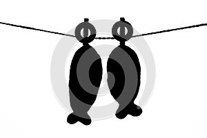 Black and white two pillows fish shape hanging on the rope