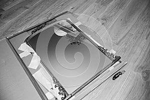 black and white Unboxing inspecting new vintage wooden luxury framed mirror