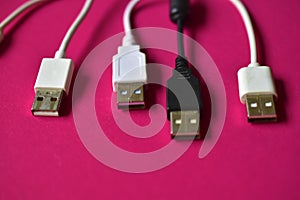 Black and white USB connectors on a red background