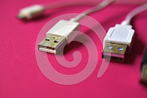 Black and white USB connectors on a red background