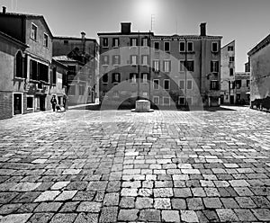Black and white Venice. The sun-drenched square of the old town. Italy. Veneto. Venice