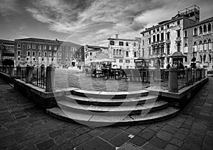 Black and white Venice. View of the old town square and stairs. Venice without water. Italy. Veneto