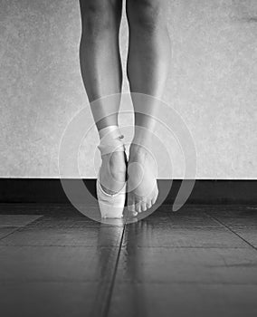 Black and White version of a ballerina`s feet behind the scenes