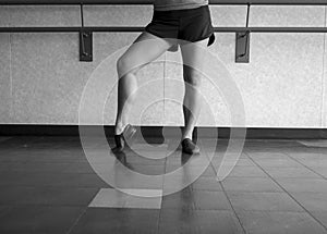 Black and white version of Jazz dancer pose with foot in dig