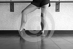 Black and white version of Jazz dancer pose with foot in dig