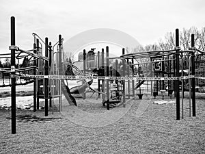 Black and white version of School Playground closures due to Covid 19 with caution tape around the playground