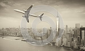 Black and white view of airplane over New York City. Tourism con