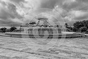 Black and white view of the ancient Tritons Fountain in the historic center of Valletta, Malta