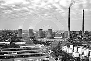 A black and white view of Coal Power Plant with large Chimneys