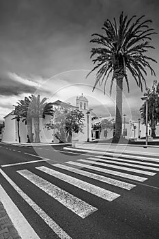 Black and white view of the parish church of Our Lady of Los Remedios in the square of the same name, Yaiza, Lanzarote, Spain
