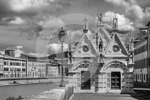 Black and white view of Santa Maria della Spina, beautiful Church on the banks of the Arno river in Pisa, Tuscany, Italy