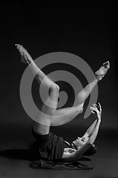 Black and white vintage dramatic portrait of a dancing girl-ballerina