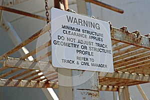 Black and white Warning - Minimum Structure Clearance Applies sign