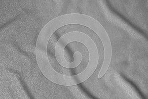 Black and white wavy silk fabric with folds. Mockup and blank designer for making a flag on a gray background