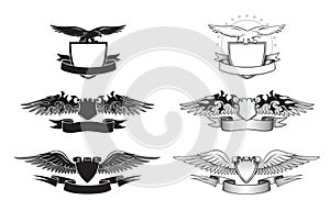 Black and white winged insignias