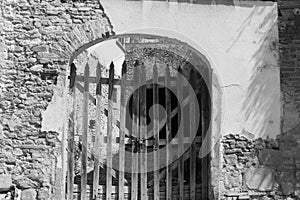 Black and white wooden gate in an archway