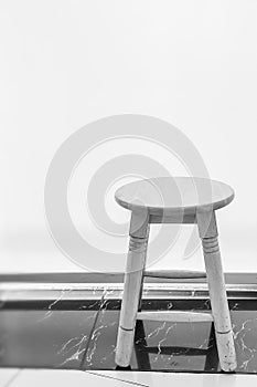 Black and white wooden stool on white background. Covid19 Social distancing