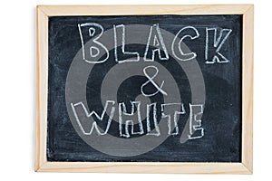 Black and White - written on chalkboard. Concept message