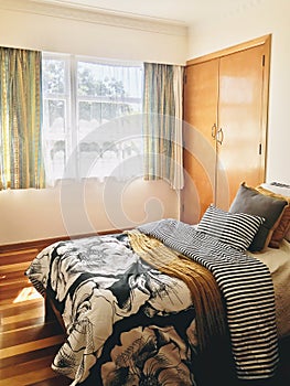 The black, white and yellow floral pattern bedroom. Interior design.