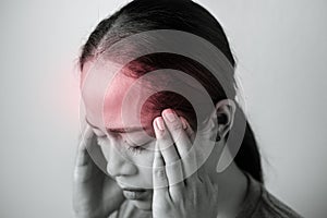 Black and white young woman with of stress and headaches