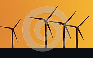 Black wind turbines on orange background