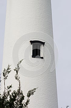 Black Window in White Brick Lighthouse