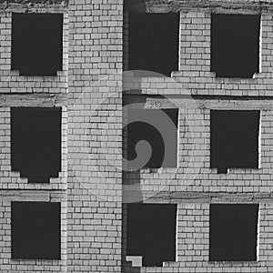 Black windows of an abandoned building
