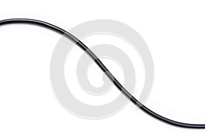 Black wire cable isolated on a white background abstraction