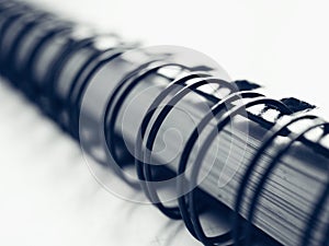 Black wire ring binding on a notebook