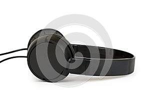 Black wired headphones isolated on white background