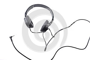 Black wired headphones on a white background