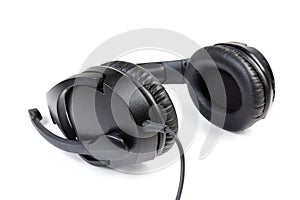 Black wired headset with full size headphones close-up