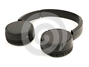 black wireless headphones insulated on a white background