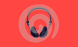 Black wireless headphones isolated on red background, top view