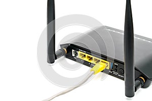 Black wireless router with local area network cable isolated on white background