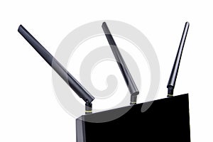 Black wireless wi-fi router cable modem, close view on three antennas, macro, closeup isolated on white. MIMO technology photo